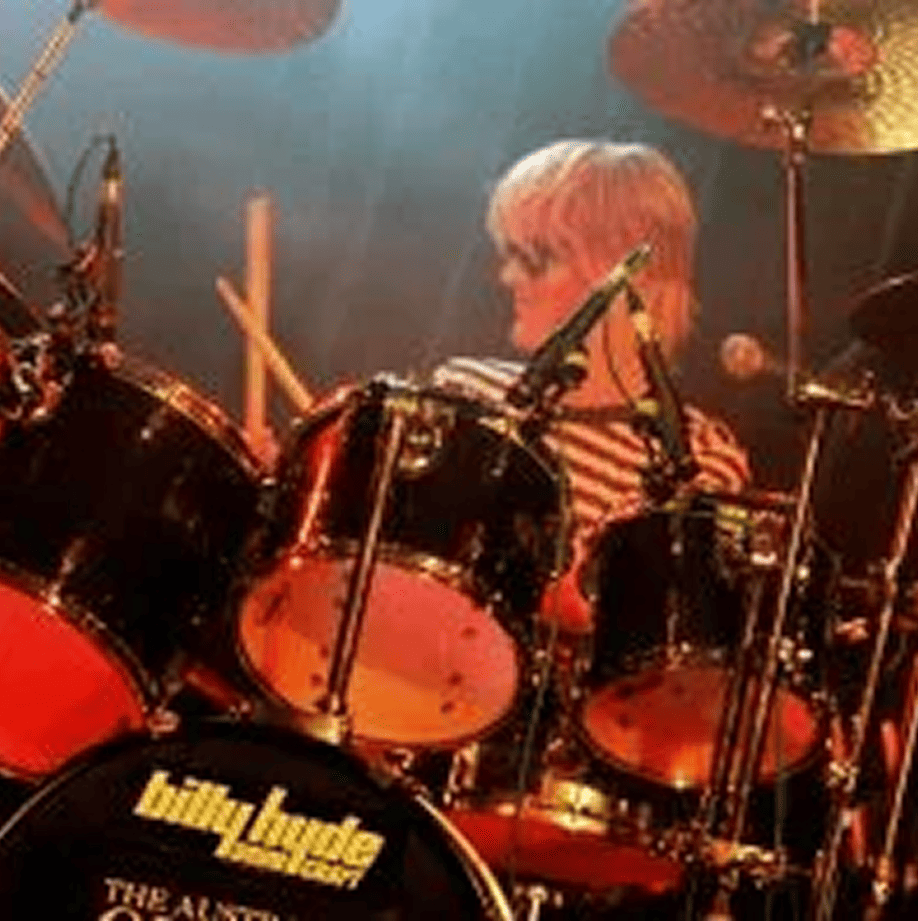 Brad Hodge performing the role of Roger Taylor in Queen Forever, delivering dynamic drumming and vocal elements inspired by Queen’s iconic drummer in the Australian tribute show