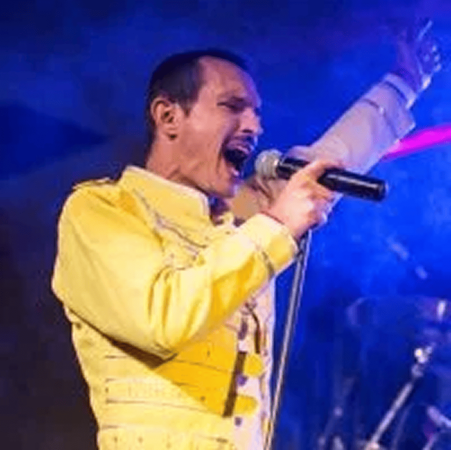 Gareth Hill performing as Freddie Mercury in Queen Forever, delivering a powerful Australian tribute that captures the energy, vocals, and stage presence of Queen’s legendary frontman